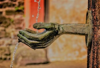 Hands-shaped fountain giving water