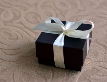 Gift, small black box with white ribbon
