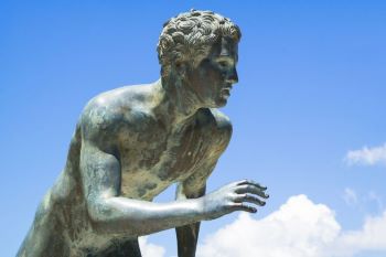 Statue of runner about to go