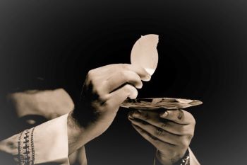 Prist with eucharist